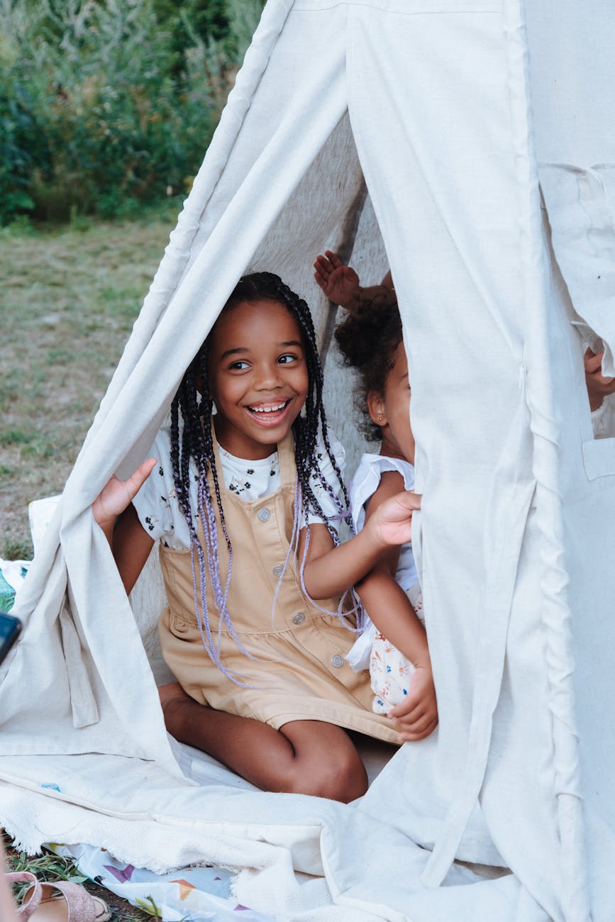 girls inside the white pyramid tent