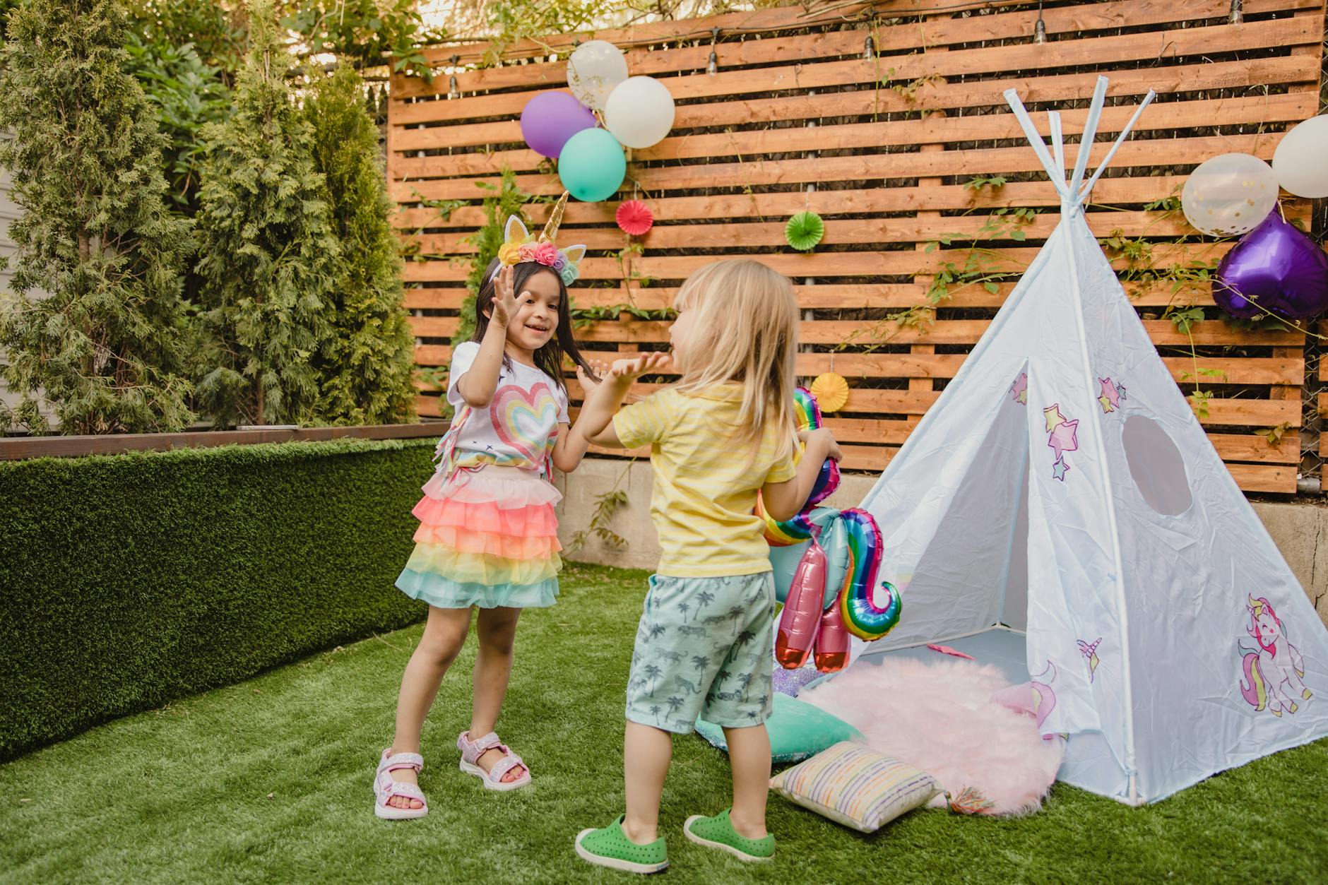 close up shot of kids standing on grass